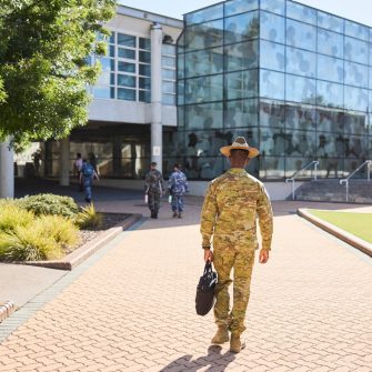 ADFA Canberra 91pro army student with bag walking towards building