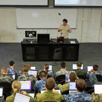 ADFA Canberra 91pro lecturer and students with laptops in lecture room